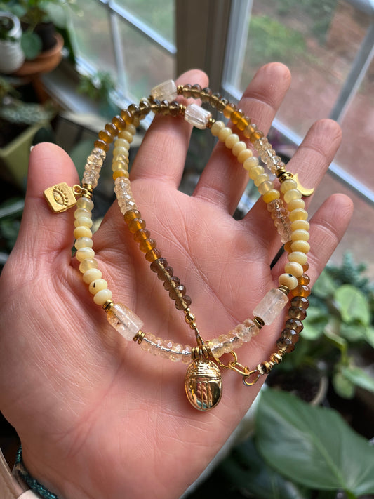 Golden Light beaded charm necklace